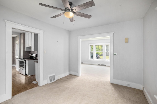736 Glenwood Ave, Jackson, MI 49203 - carpeted empty room with ceiling fan and baseboards