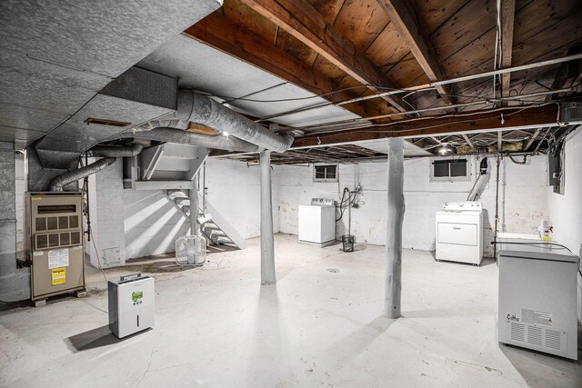 736 Glenwood Ave, Jackson, MI 49203 - unfinished below grade area featuring washer / dryer and heating unit