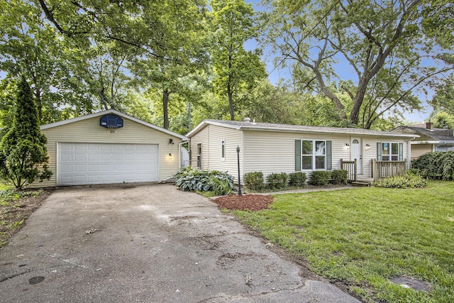 3914 Clarnin St, Kalamazoo, MI 49004 - view of front facade featuring an outbuilding, a front lawn, and a detached garage