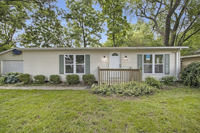 3914 Clarnin St, Kalamazoo, MI 49004 - view of front of property with a front lawn and a detached garage