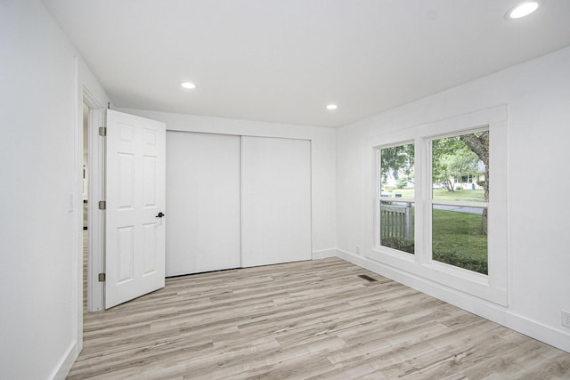 3914 Clarnin St, Kalamazoo, MI 49004 - unfurnished bedroom featuring wood finished floors, recessed lighting, and a closet