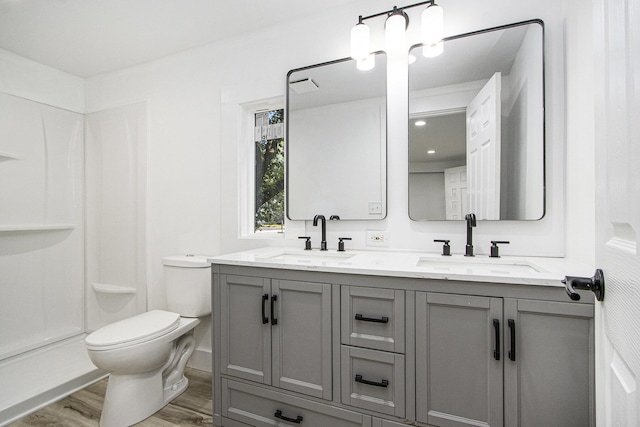 3914 Clarnin St, Kalamazoo, MI 49004 - full bath featuring wood finished floors and double vanity