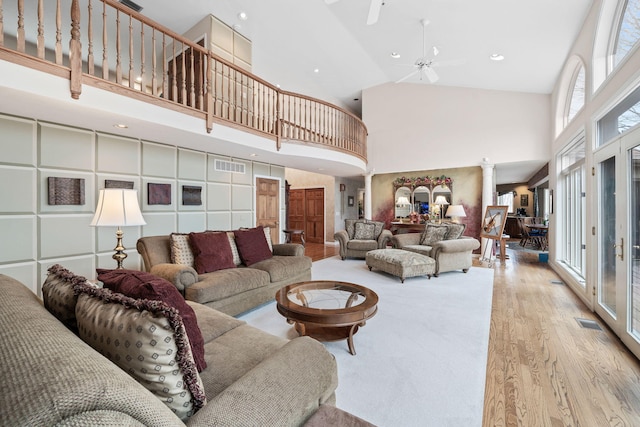 10185 N 650 E, Indiana, IN 46552 - living area featuring high vaulted ceiling, light wood-type flooring, ornate columns, a ceiling fan, and recessed lighting
