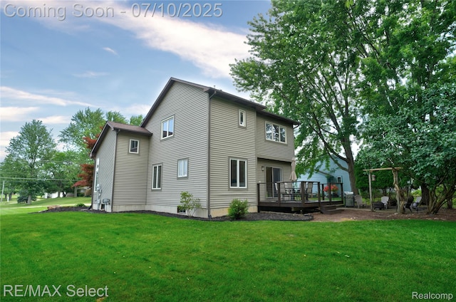 220 E Rolston Rd, Linden, MI 48451 - rear view of house featuring a wooden deck and a yard