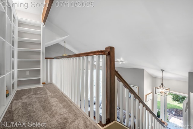 220 E Rolston Rd, Linden, MI 48451 - staircase featuring a chandelier, carpet floors, and vaulted ceiling