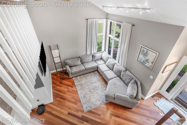 220 E Rolston Rd, Linden, MI 48451 - living area with rail lighting and light wood-type flooring