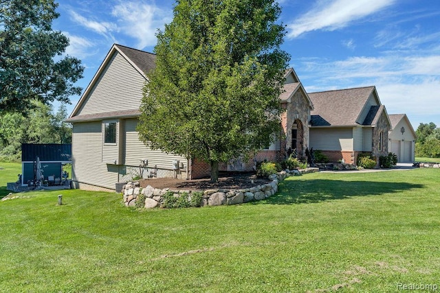 11068 Meadowview Dr, Goodrich, MI 48438 - view of front of home featuring a front yard, brick siding, and a garage