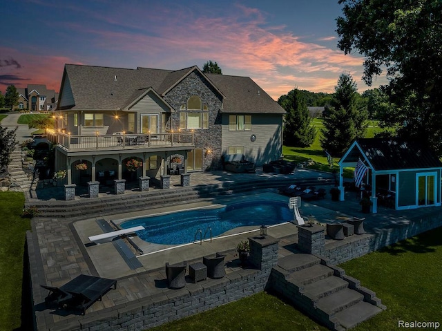 11068 Meadowview Dr, Goodrich, MI 48438 - swimming pool with a diving board, a patio area, and a jacuzzi