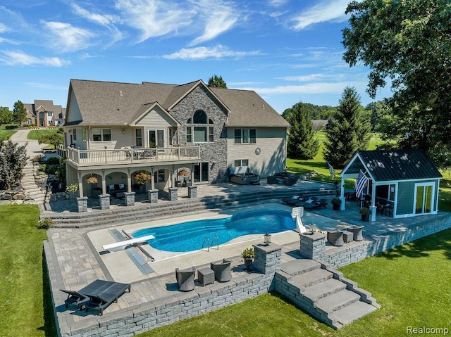11068 Meadowview Dr, Goodrich, MI 48438 - outdoor pool featuring an outbuilding, a lawn, a diving board, and a patio area