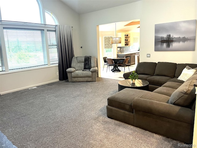 11068 Meadowview Dr, Goodrich, MI 48438 - living room featuring healthy amount of natural light, carpet, and vaulted ceiling