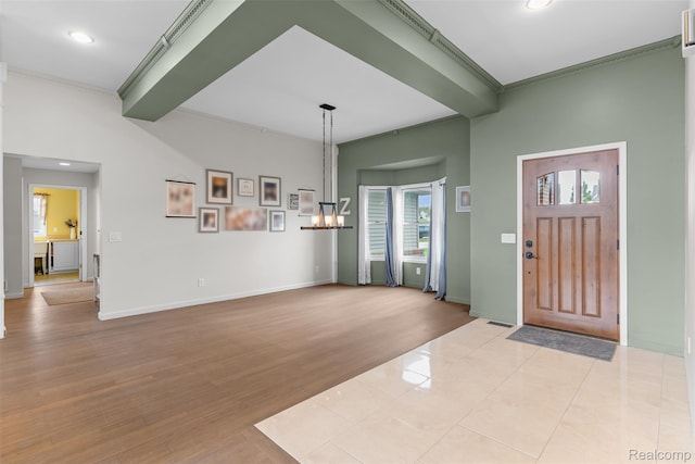11068 Meadowview Dr, Goodrich, MI 48438 - entryway featuring ornamental molding, a chandelier, wood finished floors, and recessed lighting