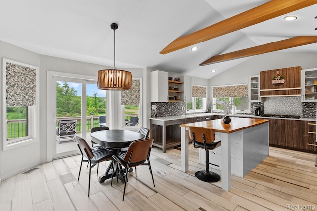 11068 Meadowview Dr, Goodrich, MI 48438 - kitchen with open shelves, decorative backsplash, stainless steel gas cooktop, healthy amount of natural light, and recessed lighting