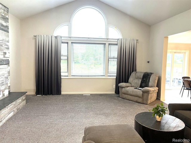 11068 Meadowview Dr, Goodrich, MI 48438 - living room featuring carpet, healthy amount of natural light, and vaulted ceiling