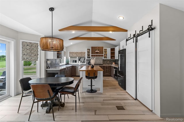 11068 Meadowview Dr, Goodrich, MI 48438 - dining area featuring a barn door, light wood finished floors, and recessed lighting