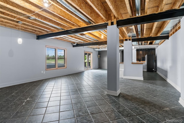 11068 Meadowview Dr, Goodrich, MI 48438 - basement with freestanding refrigerator and dark tile patterned floors