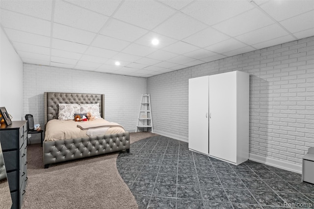 11068 Meadowview Dr, Goodrich, MI 48438 - bedroom featuring brick wall, a drop ceiling, and recessed lighting