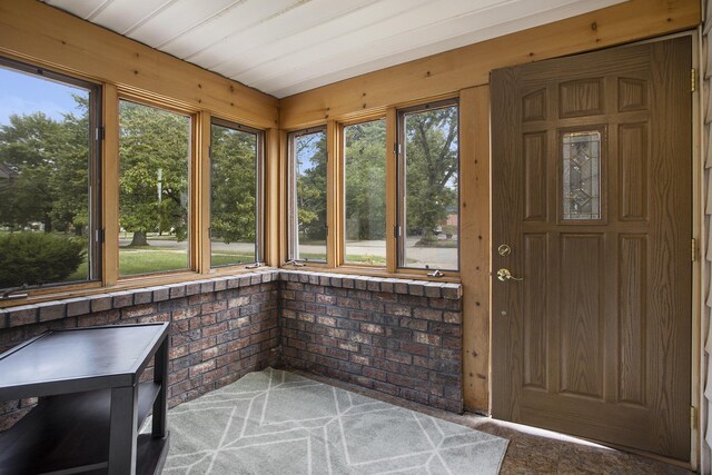 1115 Reycraft Dr, Kalamazoo, MI 49001 - unfurnished sunroom with carpet flooring and wooden walls