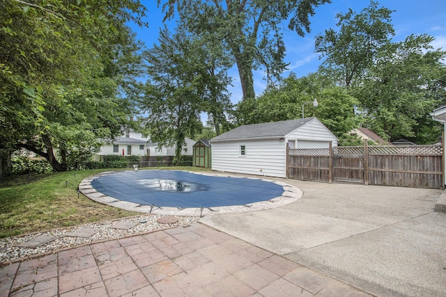 1115 Reycraft Dr, Kalamazoo, MI 49001 - view of swimming pool with a shed and a patio