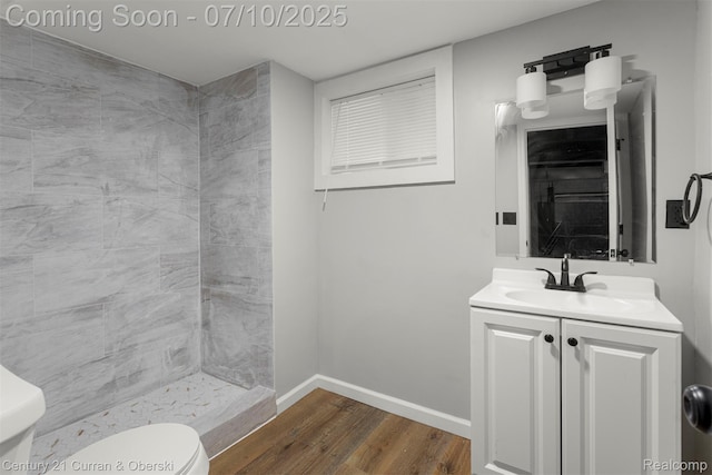 4115 Montgomery St, Detroit, MI 48204 - full bathroom with wood finished floors, vanity, and a tile shower
