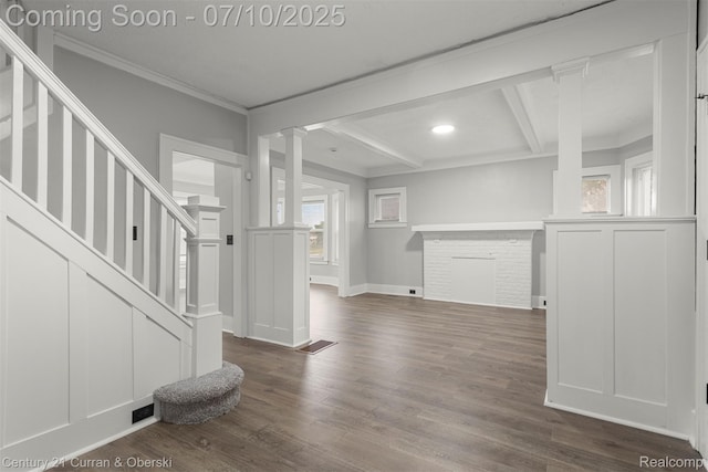 4115 Montgomery St, Detroit, MI 48204 - spare room featuring stairway, dark wood-type flooring, decorative columns, crown molding, and beam ceiling