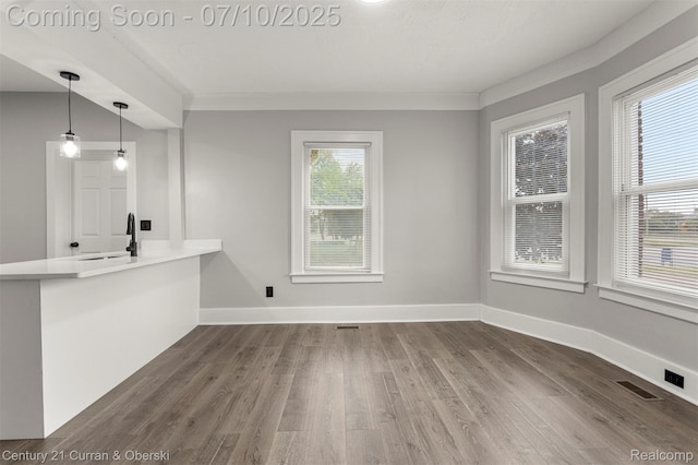 4115 Montgomery St, Detroit, MI 48204 - unfurnished living room featuring dark wood-style floors and baseboards