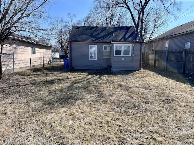 7511 Orchard Ave, Warren, MI 48091 - back of property featuring a fenced backyard and a shingled roof