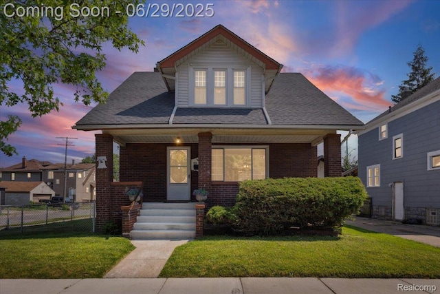 103 Elm St, River Rouge, MI 48218 - view of front facade with covered porch, brick siding, and roof with shingles
