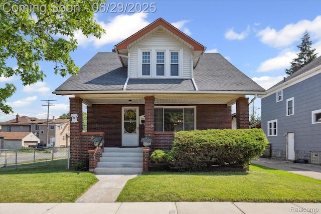 103 Elm St, River Rouge, MI 48218 - bungalow featuring a porch, brick siding, and roof with shingles