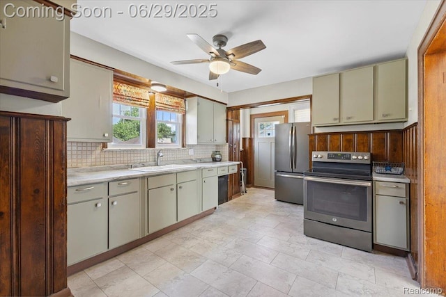 103 Elm St, River Rouge, MI 48218 - kitchen with appliances with stainless steel finishes, decorative backsplash, light countertops, and a ceiling fan