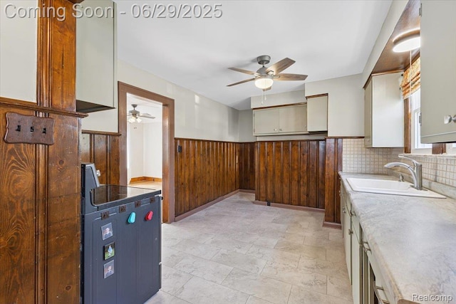 103 Elm St, River Rouge, MI 48218 - kitchen with a ceiling fan, a wainscoted wall, light countertops, and wooden walls