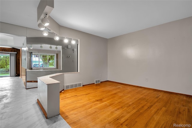 30232 Austin Dr, Warren, MI 48092 - spare room featuring track lighting and light wood finished floors