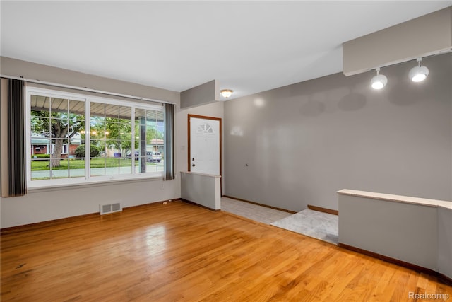 30232 Austin Dr, Warren, MI 48092 - entrance foyer featuring rail lighting and wood finished floors