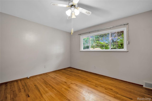 30232 Austin Dr, Warren, MI 48092 - empty room with wood finished floors and a ceiling fan