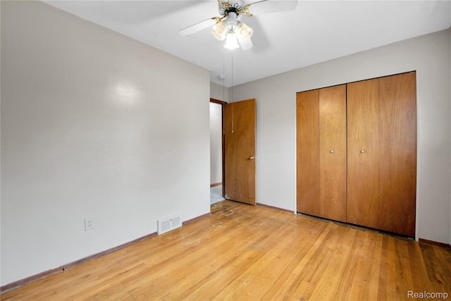 30232 Austin Dr, Warren, MI 48092 - unfurnished bedroom with wood finished floors, a closet, and ceiling fan