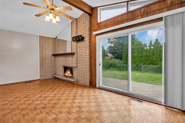 30232 Austin Dr, Warren, MI 48092 - unfurnished living room with a ceiling fan, healthy amount of natural light, a brick fireplace, and wood walls