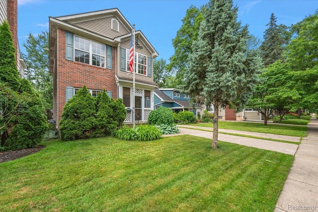 366 Marshall St, Ferndale, MI 48220 - view of front of home with brick siding and a front lawn