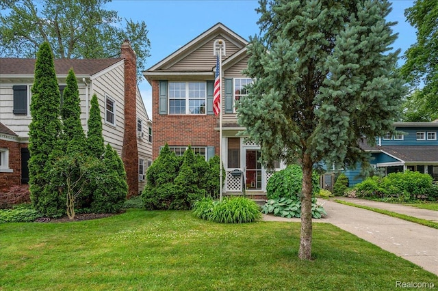 366 Marshall St, Ferndale, MI 48220 - view of front of house with a front lawn, driveway, a chimney, and brick siding