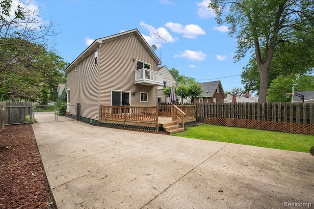 366 Marshall St, Ferndale, MI 48220 - rear view of house featuring a balcony, a fenced backyard, a deck, and a patio area