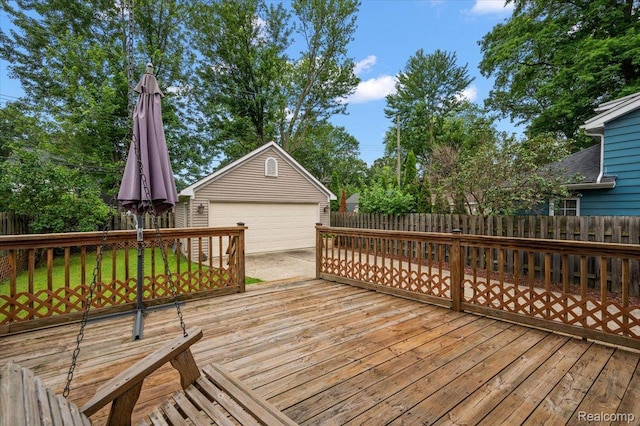 366 Marshall St, Ferndale, MI 48220 - wooden terrace featuring an outbuilding, a fenced backyard, and a detached garage