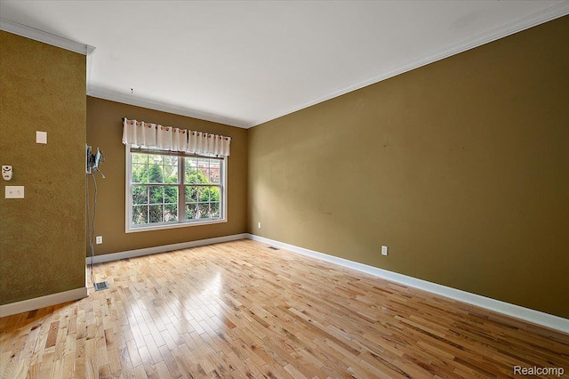 366 Marshall St, Ferndale, MI 48220 - spare room featuring light wood-style floors and ornamental molding