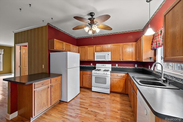 366 Marshall St, Ferndale, MI 48220 - kitchen featuring white appliances, ceiling fan, light wood-style flooring, dark countertops, and brown cabinetry