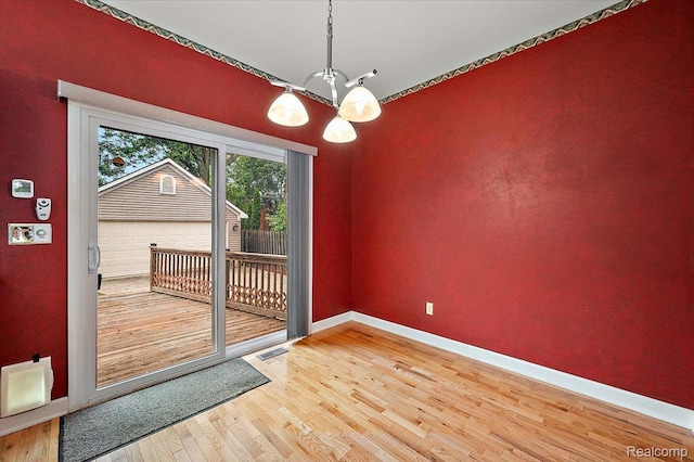 366 Marshall St, Ferndale, MI 48220 - entryway with wood finished floors and a chandelier