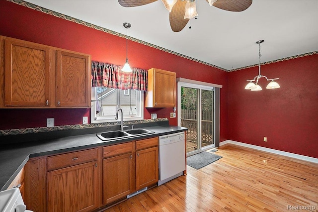 366 Marshall St, Ferndale, MI 48220 - kitchen with white dishwasher, brown cabinetry, and dark countertops