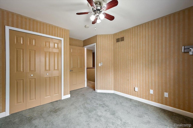 366 Marshall St, Ferndale, MI 48220 - unfurnished bedroom featuring carpet floors, a closet, wallpapered walls, and a ceiling fan