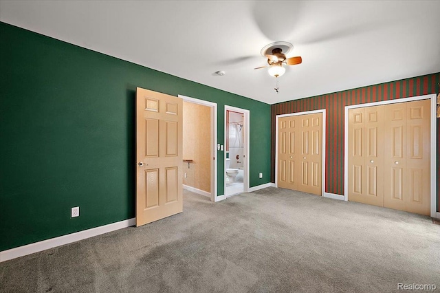 366 Marshall St, Ferndale, MI 48220 - unfurnished bedroom with two closets, ensuite bath, carpet floors, and a ceiling fan