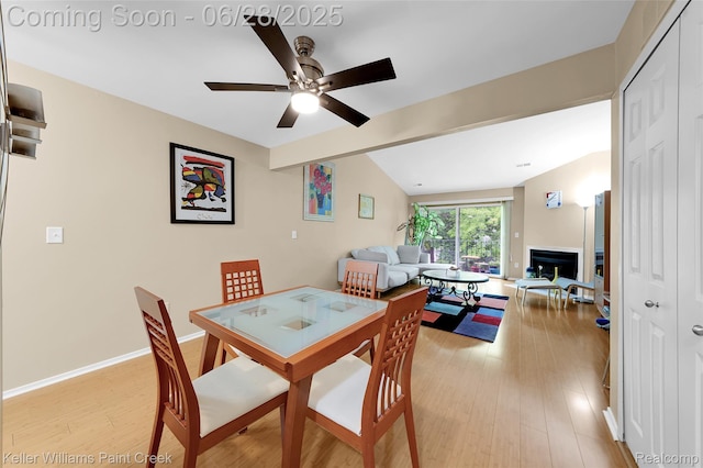 31514 Orchard Crk, Farmington Hills, MI 48334 - dining room with light wood-type flooring, a fireplace, and ceiling fan