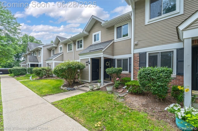 31514 Orchard Crk, Farmington Hills, MI 48334 - view of front facade with brick siding and a front lawn