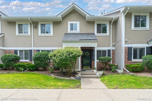 31514 Orchard Crk, Farmington Hills, MI 48334 - view of property with brick siding and a front lawn