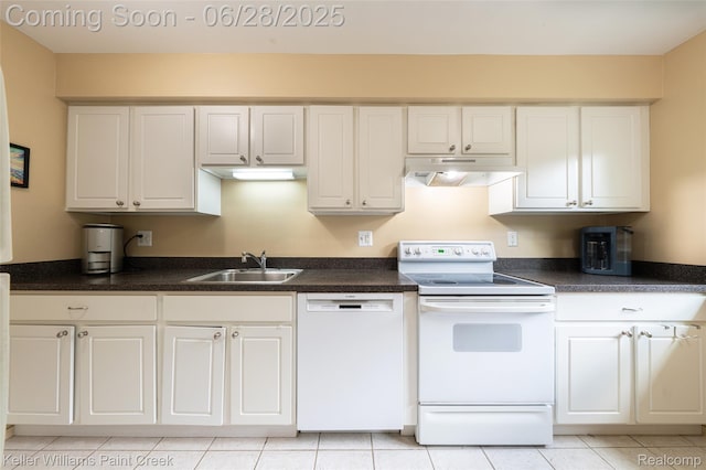 31514 Orchard Crk, Farmington Hills, MI 48334 - kitchen with white appliances, under cabinet range hood, white cabinets, and dark countertops