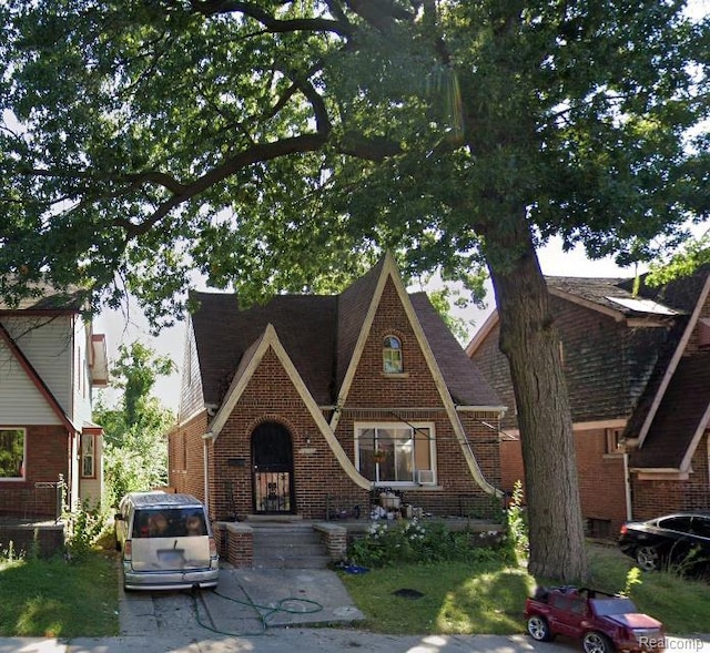 15100 Lesure St, Detroit, MI 48227 - tudor house with brick siding and roof with shingles